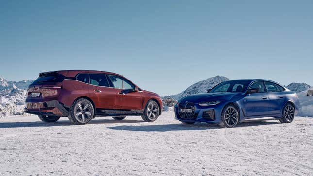 A photo of a BMW iX SUV and BMW i4 electric sedan on snow. 