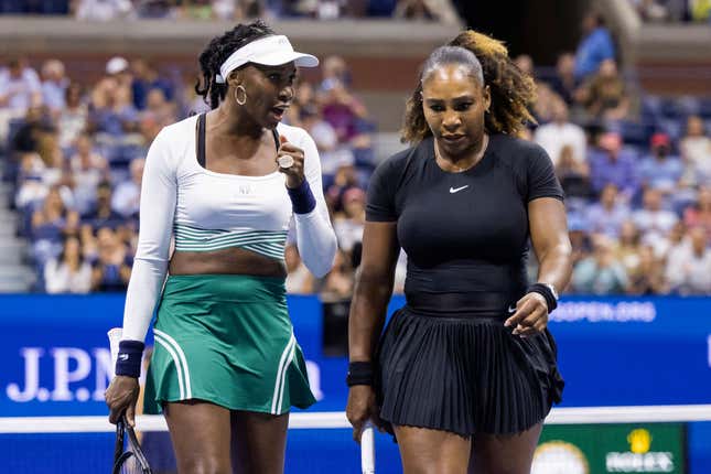 Serena Williams (R) and Venus Williams confer as they play against Czech Republic’s Lucie Hradecka and Linda Noskova during their 2022 US Open Tennis tournament women’s doubles first round match at the USTA Billie Jean King National Tennis Center in New York, on September 1, 2022. (Photo by COREY SIPKIN / AFP) (Photo by COREY SIPKIN/AFP via Getty Images)