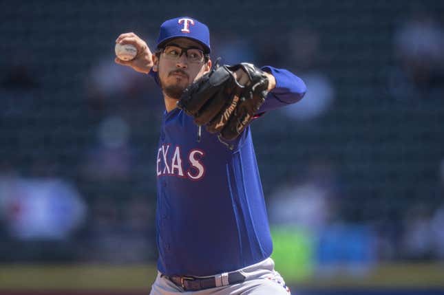 May 10, 2023; Seattle, Washington, USA; Texas Rangers starter Dane Dunning (33) delivers a pitch during the first inning against the Seattle Mariners at T-Mobile Park.