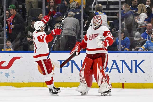 Mar 21, 2023; St. Louis, Missouri, USA;  Detroit Red Wings goaltender Magnus Hellberg (45) and center Dylan Larkin (71) celebrate after the Red Wings defeated the St. Louis Blues in shootouts at Enterprise Center.