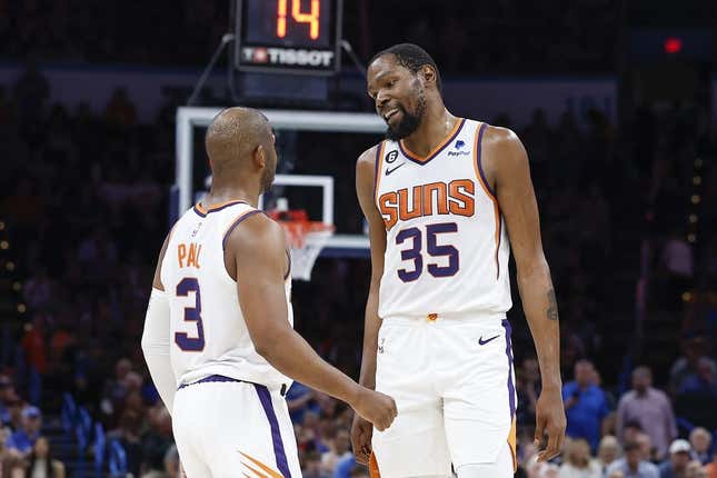 Apr 2, 2023; Oklahoma City, Oklahoma, USA; Phoenix Suns guard Chris Paul (3) and forward Kevin Durant (35) talk during the second half against the Oklahoma City Thunder at Paycom Center. Phoenix won 128-118.