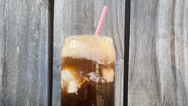 Espresso Soda Float in a glass with a striped straw