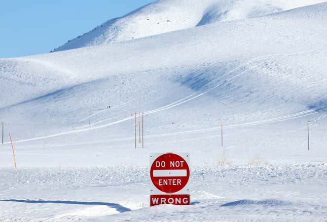 A traffic sign buried in snow in Mammoth Lakes, CA.