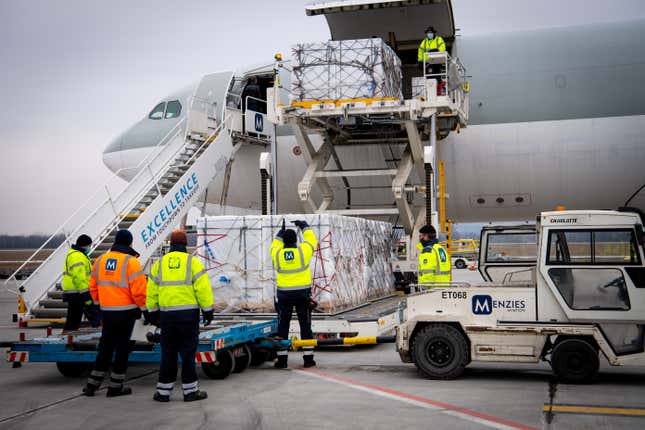 Workers unload a shipment of Chinese Sinopharm's coronavirus disease (COVID-19) vaccine as it arrives at Budapest Airport, Hungary, February 16, 2021.
