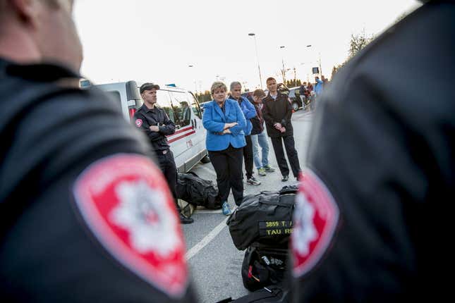 Norway’s Prime Minister Erna Solberg with members of Norwegian search and rescue team.