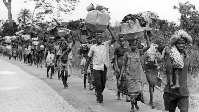 Leaving home. Locals in south east Nigeria in 1968 during the peak of the Biafra war.