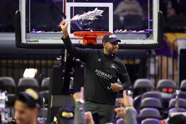 Howard Bison head coach Kenny Blakeney celebrates with the net after defeating the Norfolk State Spartans to win the 2023 MEAC Men’s Basketball Tournament Championship.