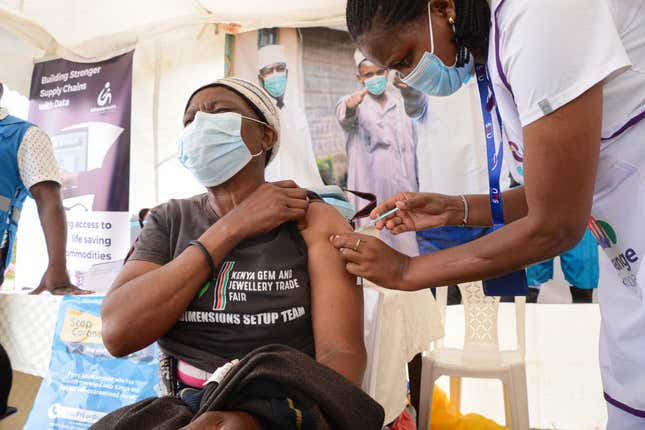 NAIROBI, KENYA - 2022/02/03: A healthcare worker administers Pfizer vaccine to a resident of Dagoretti in Nairobi during a mass vaccination drive countrywide. 
