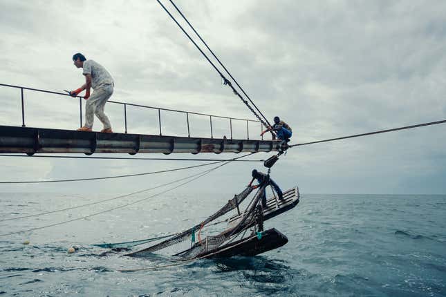 Staff on a ship near Guinea-Bissau try to release a strut that has become stuck.