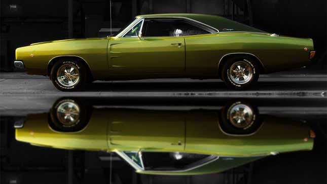 A green Dodge Charger muscle car. 