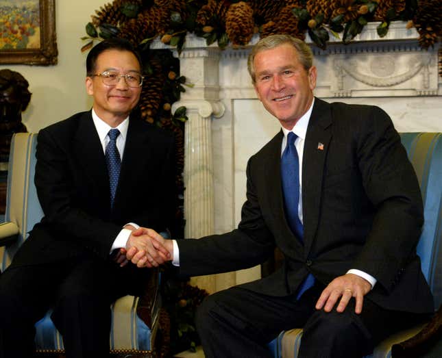 Bush shakes hands with Wen at the Oval office on Dec. 9, 2003.