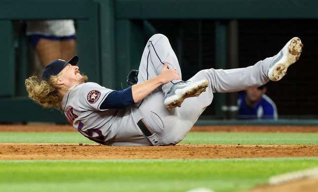 Sep 4, 2023; Arlington, Texas, USA;  Houston Astros relief pitcher Ryne Stanek (45) injures himself during the ninth inning against the Texas Rangers at Globe Life Field.