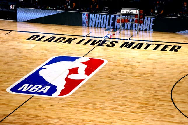  An overview of the basketball court shows the NBA logo and Black Lives Matter before the start of a game between the Denver Nuggets and the Miami Heat at HP Field House at ESPN Wide World Of Sports Complex on August 01, 2020 in Lake Buena Vista, Florida. 