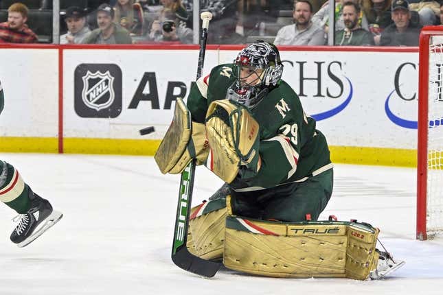 Apr 11, 2023; Saint Paul, Minnesota, USA;  Minnesota Wild goalie Marc-Andre Fleury (29) makes a glove save against the Winnipeg Jets during the third period at at Xcel Energy Center.