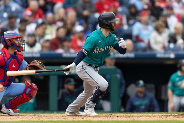 April 27, 2023;  Philadelphia, Pennsylvania, USA;  Seattle Mariners third baseman Tommy La Stella (4) hits a single during the seventh inning against the Philadelphia Phillies at Citizens Bank Park.