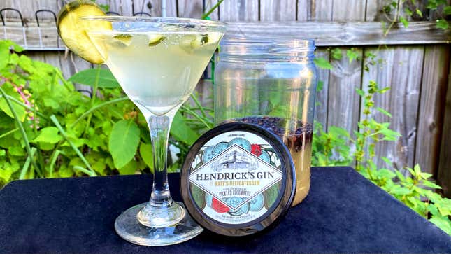 Hendrick's gin pickle cocktail in martini glass beside jar of pickles