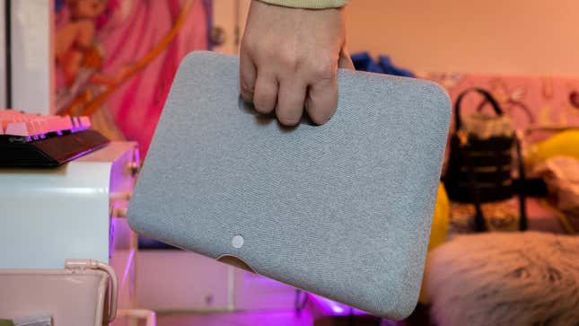 A photo of a person carrying the Portal Go by its handle
