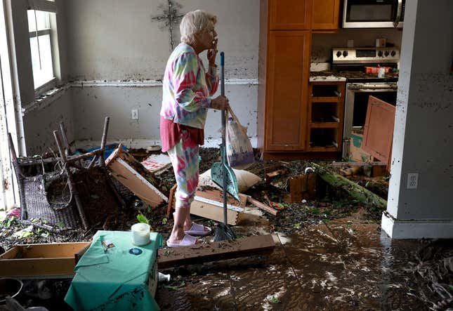 Stedi Scuderi looks over her apartment after flood water inundated it when Hurricane Ian passed through the area on September 29, 2022 in Fort Myers, Florida.
