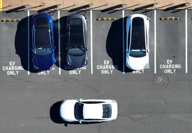  In an aerial view, Tesla cars recharge at a Tesla charger station on February 15, 2023 in Corte Madera, California. Electric car company Tesla is partnering with the U.S. federal government to expand electric vehicle charging infrastructure in the United States. Tesla announced plans to open an estimated 7,500 of its Tesla Superchargers in the country to all brands of electric vehicles by the end of 2024.