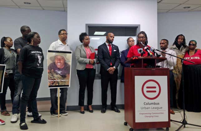 Adrienne Hood speaks about her son Henry Green, fatally shot in June 2016 by two white police officers in Columbus, Ohio, as relatives, attorneys and others look on at a news conference in Columbus, Ohio, Sept. 27, 2016.