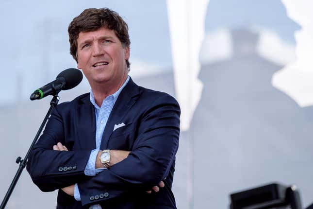 Fox News host Tucker Carlson has promoted the same racist conspiracy theory cited by the Buffalo mass shooter on his show more than 400 times. Now he’s being called out for it. 
