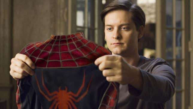 Tobey Maguire holding his costume in the original Spider-Man films.