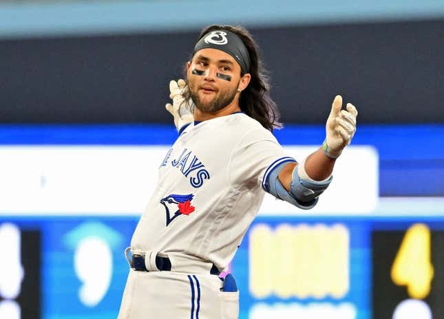 Apr 14, 2023; Toronto, Ontario, CAN;    Toronto Blue Jays shortstop Bo Bichette (11) reacts after hitting a double against the Tampa Bay Rays in the eighth inning at Rogers Centre.