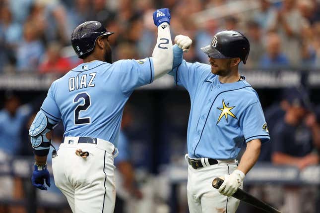 Apr 13, 2023; St. Petersburg, Florida, USA;  Tampa Bay Rays first baseman Yandy Diaz (2) celebrates with Tampa Bay Rays second baseman Brandon Lowe (8) after hitting a home run against the Boston Red Sox in the first inning at Tropicana Field.