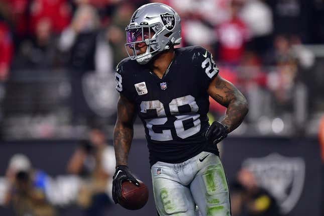 January 1, 2023; Paradise, Nevada, USA; Las Vegas Raiders running back Josh Jacobs (28) scores a touchdown against the San Francisco 49ers during the second half at Allegiant Stadium.