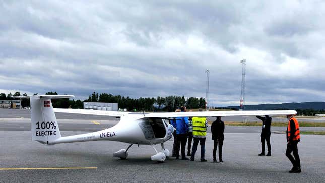 A two-seat electric plane made by Slovenian firm Pipistrel stands outside a hangar at Oslo Airport, Norway.