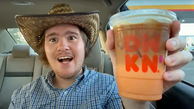 Man in cowboy hat holding up peanut butter macchiato