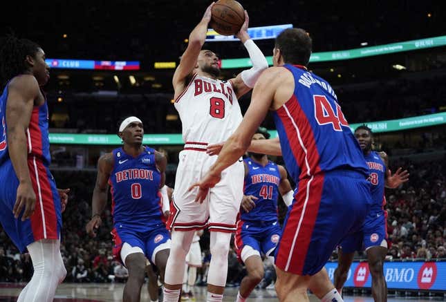 Dec 30, 2022; Chicago, Illinois, USA; Detroit Pistons forward Bojan Bogdanovic (44) defends Chicago Bulls guard Zach LaVine (8) during the second half at United Center.