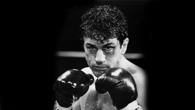 Robert DeNiro shirtless with boxing gloves on in boxing movie Raging Bull.