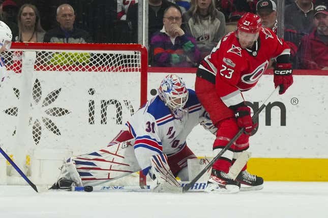 Mar 23, 2023; Raleigh, North Carolina, USA;  New York Rangers goaltender Igor Shesterkin (31) stops the shot attempt by Carolina Hurricanes right wing Stefan Noesen (23) during the second period at PNC Arena.