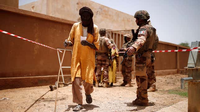 Troops from the Malian Armed Forces and members of a French military medical unit in Ndaki, Mali, July, 2019.
