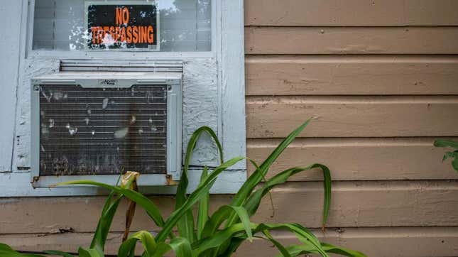 An air conditioning unit is seen in a window seal during a heatwave on July 21, 2022 in Houston, Texas.