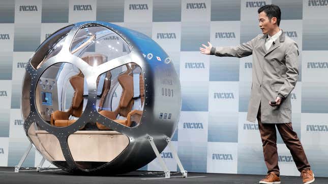 CEO Keisuke Iwaya unveiling Iwaya Giken’s two-seater cabin