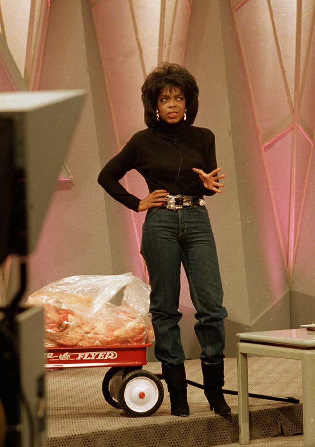 Television talk show host Oprah Winfrey shows off her new figure as she stands in front of 68 pounds of fat inside a toy wagon, in Chicago, Ill, Tuesday, Nov. 16, 1988. Winfrey credited her 68-pound weight loss to a liquid diet and excercise. Her goal was to fit into a size 10 pair of blue jeans for the first time on her syndicated TV show.