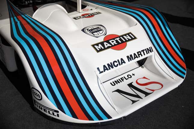 Image of an old Lancia Le Mans prototype with a decal of the classic emblem on the front