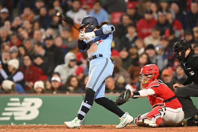 May 4, 2023; Boston, Massachusetts, USA; Toronto Blue Jays shortstop Bo Bichette (11) hits a two RBI single against the Boston Red Sox during the fifth inning at Fenway Park.