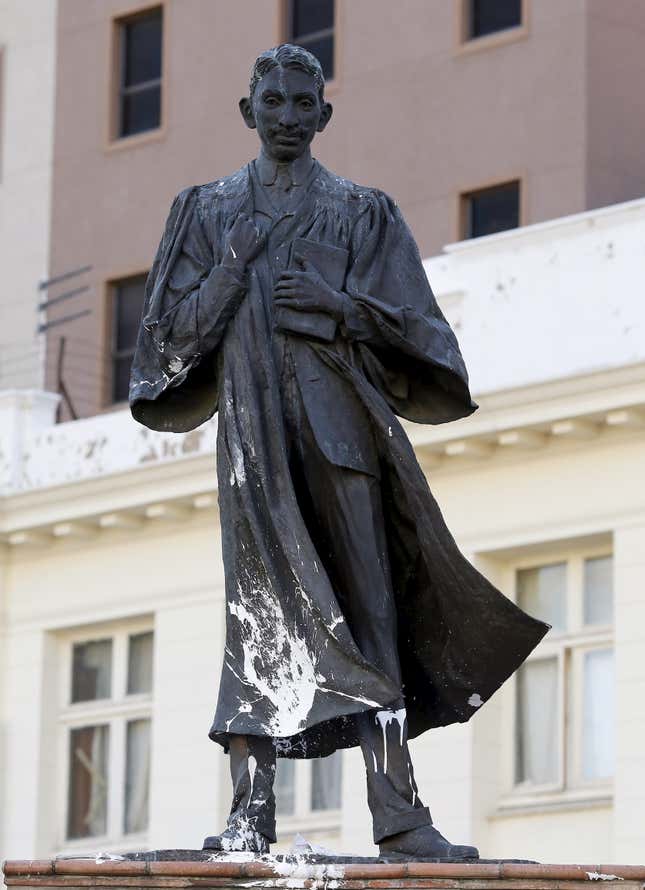 A statue of Mahatma Gandhi is seen after it was vandalized with white paint at Gandhi Square in Johannesburg Apr 13, 2015.