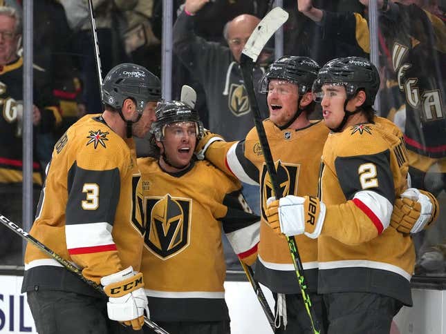 Mar 3, 2023; Las Vegas, Nevada, USA; Vegas Golden Knights center Jack Eichel (9) celebrates with defenseman Brayden McNabb (3), right wing Jonathan Marchessault (81), and  defenseman Zach Whitecloud (2) after scoring a goal against the New Jersey Devils during the third period at T-Mobile Arena.