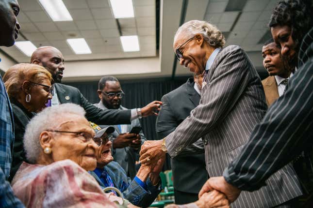 TULSA, OKLAHOMA - JUNE 01: Survivors Hughes Van Ellis and Viola Fletcher are greeted by Rev. Al Sharpton at a rally during commemorations of the 100th anniversary of the Tulsa Race Massacre on June 01, 2021 in Tulsa, Oklahoma. 