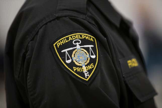 Show is the a patch on a Philadelphia correctional officer’s uniform at the Curran-Fromhold Correctional Facility in Philadelphia. (AP Photo/Matt Rourke)