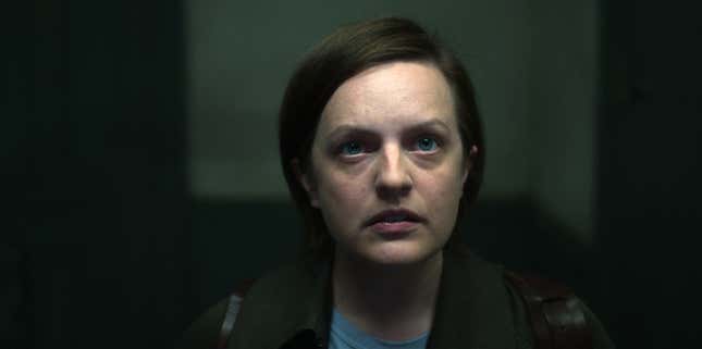 Elisabeth Moss, with short brown hair, stares at the ceiling in a scene from Shining Girls.