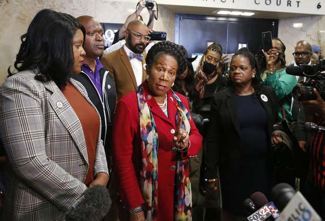 U.S. Rep. Sheila Jackson Lee, center, speaks to the media before a hearing at Tulsa County Courthouse, Monday, May 2, 2022, in Tulsa, Okla. A judge ruled Monday that a lawsuit can proceed that seeks reparations for survivors and descendants of victims of the 1921 Tulsa Race Massacre.