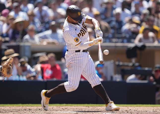 Aug 23, 2023; San Diego, California, USA; San Diego Padres shortstop Xander Bogaerts (2) hits a two run home run against the Miami Marlins during the sixth inning at Petco Park.
