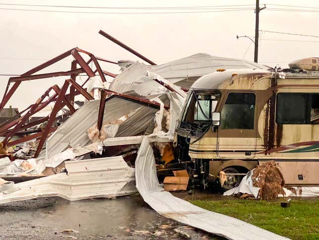 An RV in front of a destroyed structure in Arabi, Louisiana.