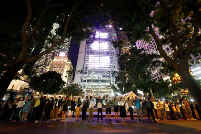 Protesters hold hands in Hong Kong’s Central district.