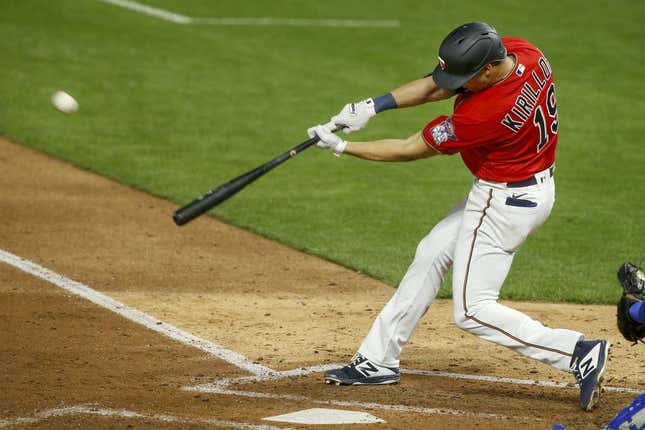 Apr 30, 2021; Minneapolis, Minnesota, USA; Minnesota Twins first baseman Alex Kiriloff (19) hits a solo home run against the Kansas City Royals manager Mike Matheny in the fifth inning at Target Field.
